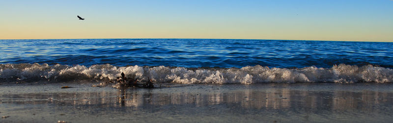 Panoramic view of sea against sky during sunset