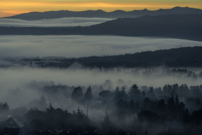 Scenic view of mountains against sky during sunset