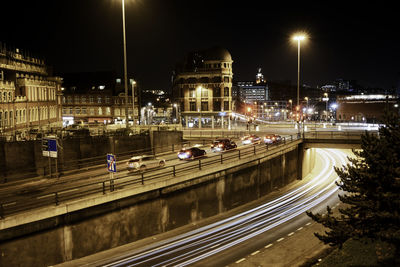 High angle view of light trails on road at night