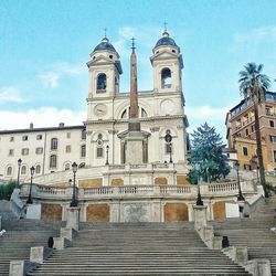 Low angle view of church against cloudy sky