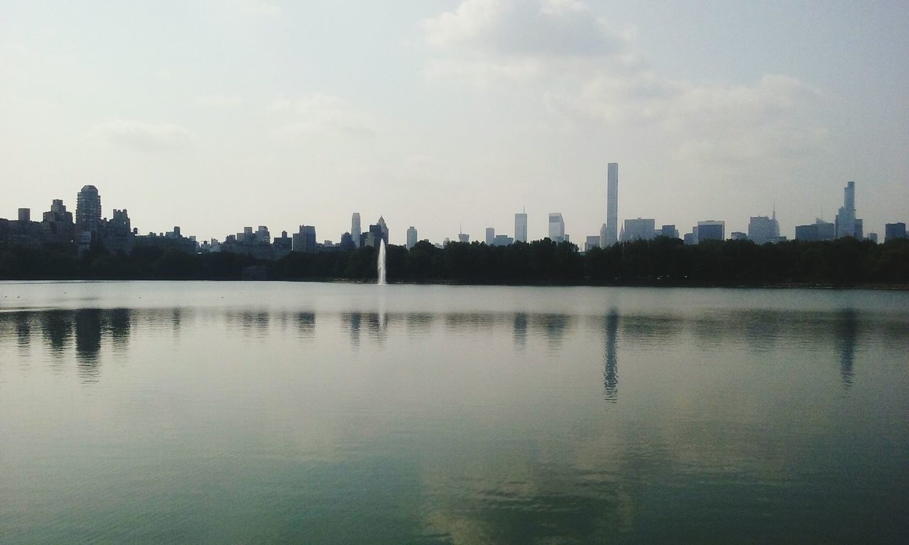 REFLECTION OF CITY IN LAKE