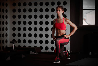 Determined woman exercising in gym