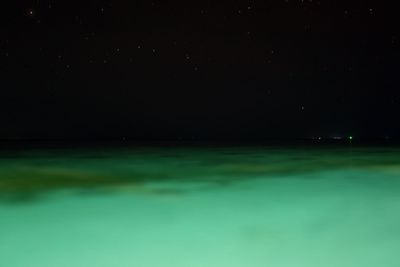 Scenic view of sea against sky at night