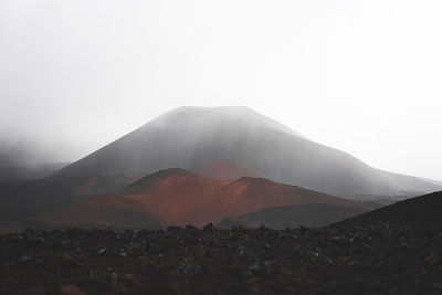 Scenic view of volcanic mountain against sky