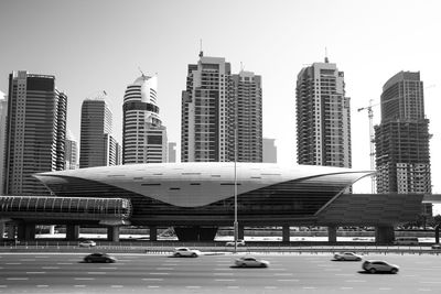 Modern buildings in city against clear sky