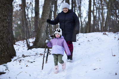 Full length of child on snow covered land