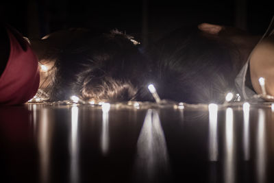 Close-up of illuminated lighting equipment on table