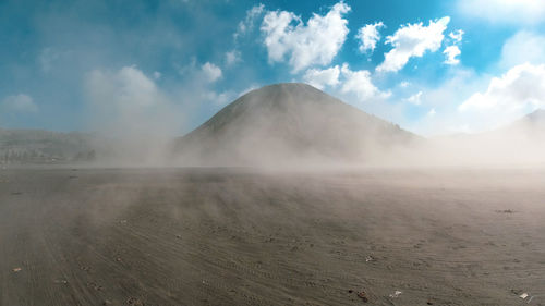 Panoramic view of volcanic landscape against sky