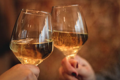 Cropped hand of woman holding wineglass