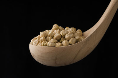 Close-up of ice cream in bowl against black background