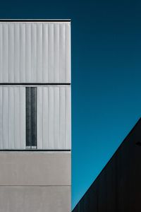 Close-up of building against blue sky