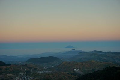 Scenic view of mountains against sky during sunset