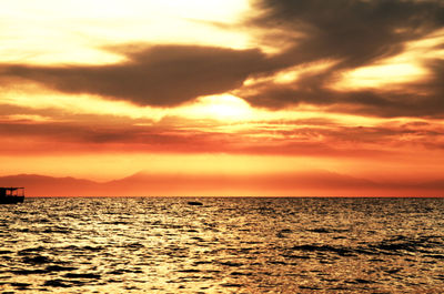 Scenic view of sea against orange sky