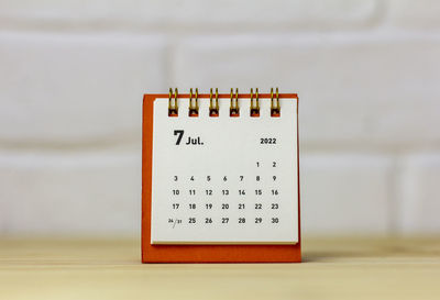 Desk calendar for july 2022 table with copy space.