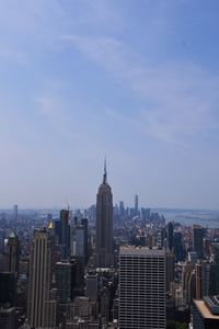 Modern buildings in city against sky