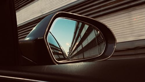 Reflection of car on side-view mirror