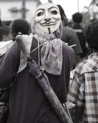 Portrait of woman standing on street in city