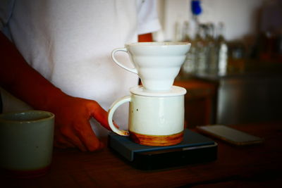 Close-up of tea cup on table at home