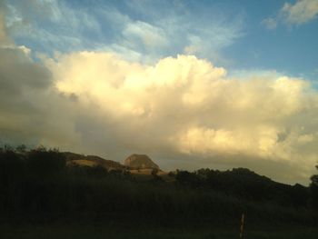 Scenic view of land against sky during sunset