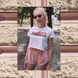 Smiling young woman wearing sunglasses standing outdoors