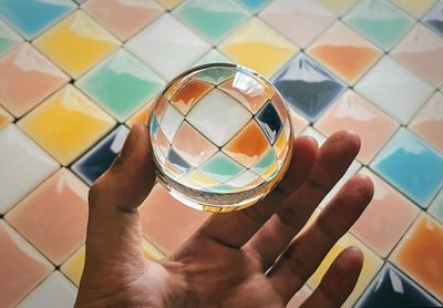 Close-up of man holding glass