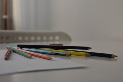 Close-up of colored pencils on table