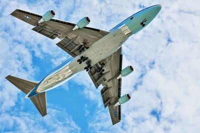 Low angle view of airplane flying in sky