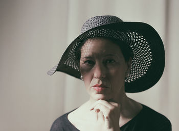 Portrait of mature woman wearing hat