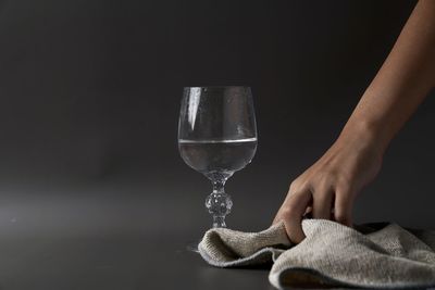 Close-up of hand holding glass of wine