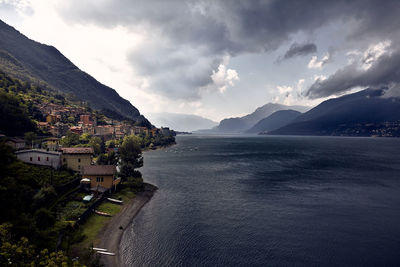 Scenic view of sea and mountains against sky