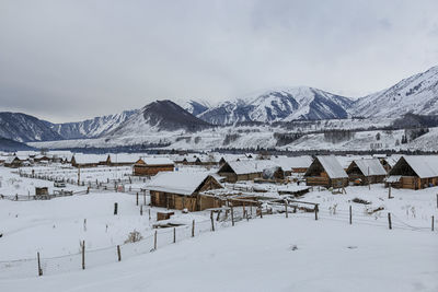 Scenic view of snow mountains against sky