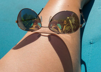 High angle view of sunglasses on swimming pool