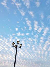 Low angle view of street light against sky