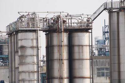 Low angle view of industrial building against sky