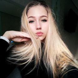 Portrait of beautiful young woman with blond hair