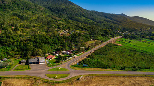 High angle view of road amidst trees in city