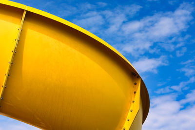 Low angle view of ferris wheel against sky