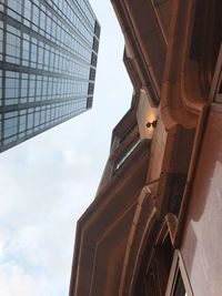 Low angle view of skyscraper against sky
