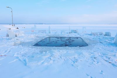 Scenic view of sea against sky during winter