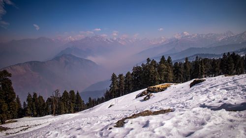 Scenic view of snow mountains against sky