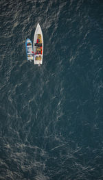 Aerial view of traditional fishing boat in caraballeda with crystal clear turquoise sea, la guaira