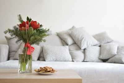 Flower vase on table at home