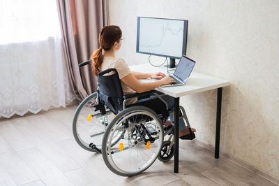 Businesswoman trading at home