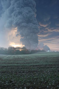 Scenic view of landscape against cloudy sky