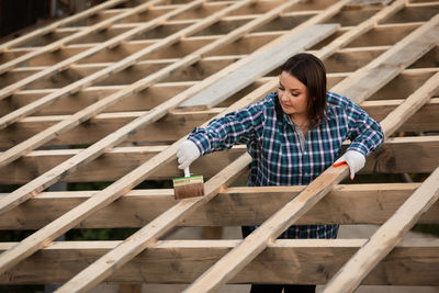 Man working on wooden plank