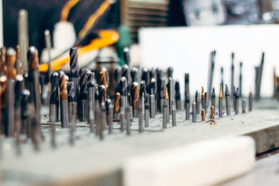 Close-up of rows of drill bits in workshop