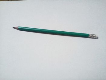 Close-up of colored pencils against white background