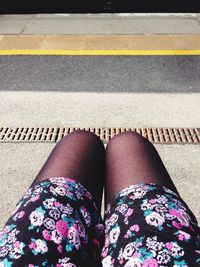 Low section of woman standing on tiled floor