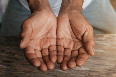 Cropped image of man on table