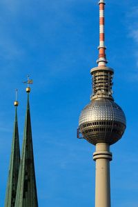 Low angle view of communications tower against clear sky